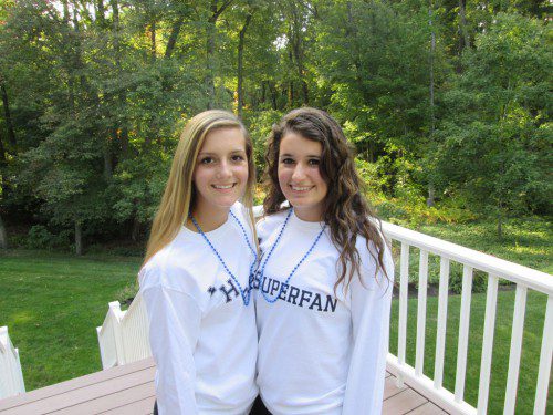 SUPER spirited students. Modeling the long-sleeved LHS Superfan t-shirts they designed are Lexi Yannone (left) and Olivia Skelley. The girls created the LHS Superfan Club to boost school spirit. They are selling Superfan Kits to students and residents that include the T-shirt, beads and either a cow bell or pom poms for $10 in advance of the first football game to be played at the new stadium on Oct. 10.       (Courtesy photo)