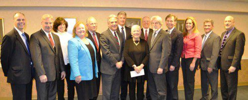 THE BOARD OF DIRECTORS of The Savings Bank recently recognized Kathleen M. Beaulieu (center of the photo), senior vice president and senior retail lending officer, as she retires from the bank after 31 years of service. Celebrating Kathy and honoring her for her dedication to the bank are (from left to right): Vice Chairman Michael Barrett, Director Glenn Dolbeare, Clerk Susan O’Neill, Director Carolyn Ogren, Director Anthony Gallugi, Executive Vice President and Chief Operating Officer Robert DiBella, Chairman John Spinello, Kathleen Beaulieu, Director Daniel Sherman, President and Chief Executive Officer Brian McCoubrey, Director Thomas Mullen, Director Karen Sawyer, Director Scott Garrant and Director Mark Simeola. 