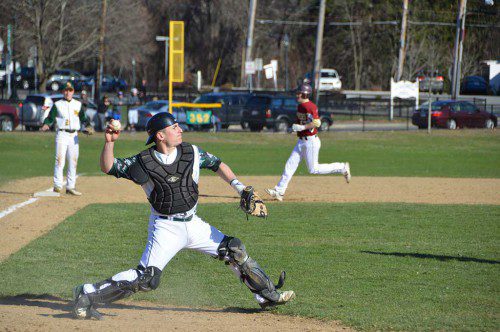 HORNET CATCHER John Merullo makes short work of a potential Newburyport baserunner as North Reading won its home opener, 2 to 1, over Newburyport. (Bob Turosz Photo)