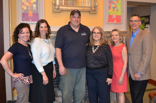 FRED BRIZEE (third from left) of Designer Lawn Sprinkler Service recently presented a donation as a Coral Reef Sponsor of the Ninth Annual Blossoms at the Beebe to benefit the Wakefield Lynnfield Chamber of Commerce and Lucius Beebe Memorial Library. Taking part in the check presentation were (from left to right) Jennifer Hickey, chair of the Blossoms at the Beebe auction committee; Marianne Cohen, executive director, Wakefield Lynnfield Chamber of Commerce; Brizee; Sharon Gilley, Library director and a member of the Board of Directors of the Wakefield Lynnfield Chamber of Commerce; Susan Wetmore, chair of the Blossoms at the Beebe; and Chris Barrett, Wakefield Lynnfield Chamber of Commerce first vice president and chair of the Blossoms at the Beebe sponsorship committee. The adult-only Blossoms at the Beebe will be held on Saturday evening, April 30 at the Library and will embrace a Caribbean Nights theme. Additional information can be obtained by contacting the Wakefield Lynnfield Chamber of Commerce or visiting the Blossoms at the Beebe website www.blossomsatbeebe.com. 