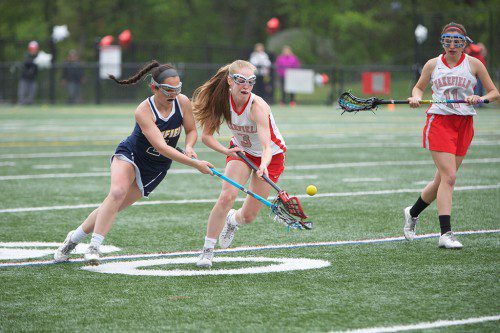 SENIORS Kelsey Czarnota (#3) and Brianna Smith (#11) are two out of five returning players for the Warrior girls’ lacrosse team this spring. (Donna Larsson File Photo)